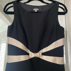 Ann Taylor black dress with champagne trim and bow in size 4.